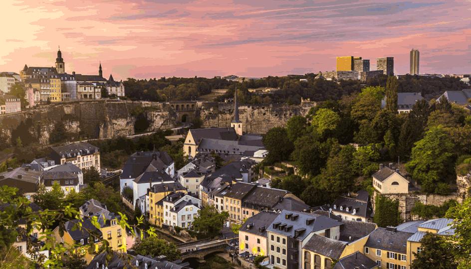 A panoramic view of Luxembourg City at sunset